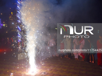 People light fireworks to celebrate the Chhath festival in Kolkata, India, on November 8, 2024. (