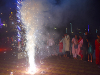 People light fireworks to celebrate the Chhath festival in Kolkata, India, on November 8, 2024. (