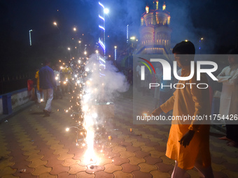 People light fireworks to celebrate the Chhath festival in Kolkata, India, on November 8, 2024. (