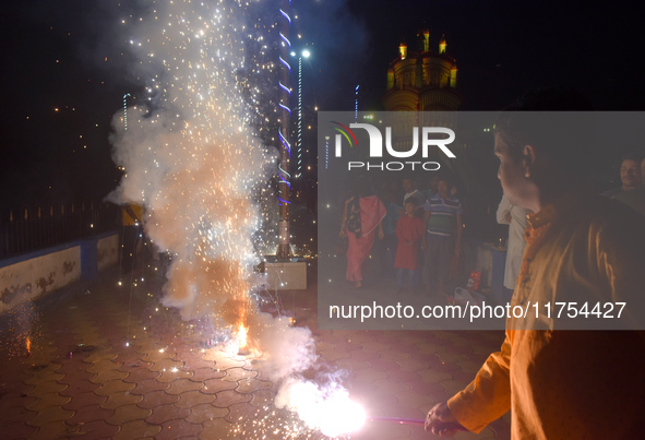 People light fireworks to celebrate the Chhath festival in Kolkata, India, on November 8, 2024. 