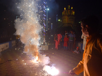 People light fireworks to celebrate the Chhath festival in Kolkata, India, on November 8, 2024. (