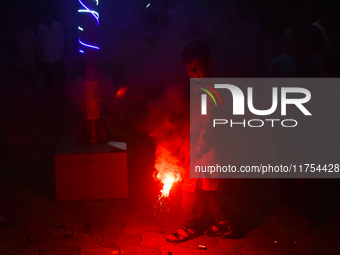 A boy lights fireworks to celebrate the Chhath festival in Kolkata, India, on November 8, 2024. (