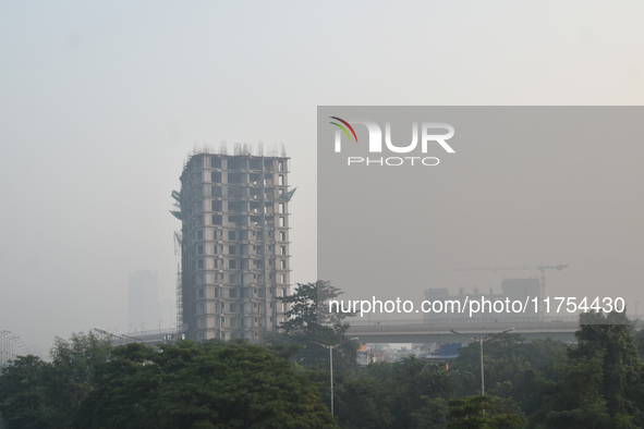 A high-rise building is pictured on a polluted, smoggy morning in Kolkata, India, on November 8, 2024. 