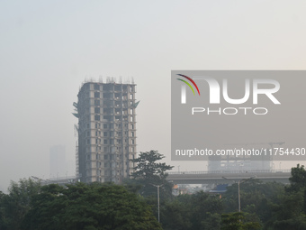 A high-rise building is pictured on a polluted, smoggy morning in Kolkata, India, on November 8, 2024. (