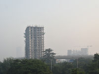 A high-rise building is pictured on a polluted, smoggy morning in Kolkata, India, on November 8, 2024. (