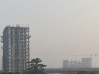 High-rise buildings are pictured on a polluted, smoggy morning in Kolkata, India, on November 8, 2024. (