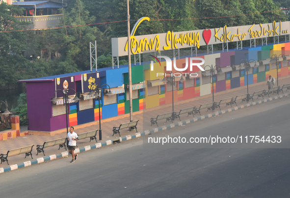 A person runs on the street on an air-polluted morning in Kolkata, India, on November 8, 2024. 