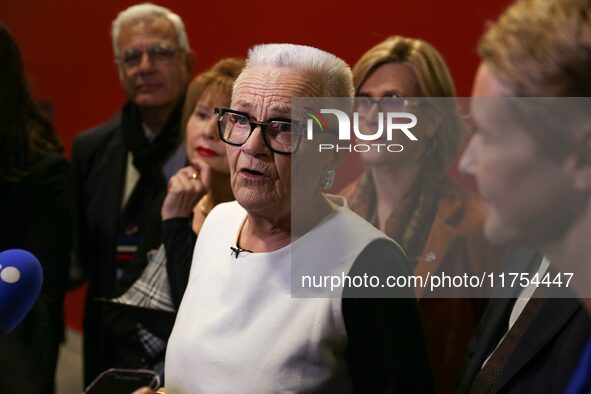 French Delegate Minister for Rural Affairs, Trade and Crafts Francoise Gatel (white jacket) speaks with the press as she opens the 12th edit...