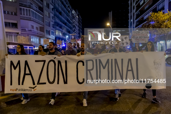 Catalan left-wing and independentist groups demonstrate in front of the headquarters of the Popular Party, led by the regional government of...