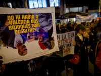 Catalan left-wing and independentist groups demonstrate in front of the headquarters of the Popular Party, led by the regional government of...