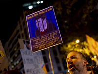 Catalan left-wing and independentist groups demonstrate in front of the headquarters of the Popular Party, led by the regional government of...