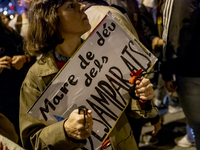 Catalan left-wing and independentist groups demonstrate in front of the headquarters of the Popular Party, led by the regional government of...