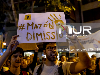 Catalan left-wing and independentist groups demonstrate in front of the headquarters of the Popular Party, led by the regional government of...