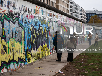  People visit East Side Gallery a day ahead of the 35th anniversary of the fall of the Berlin Wall. Berlin, Germany on November 8th, 2024. (