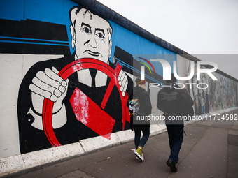 A mural with Mikhail Gorbachev at East Side Gallery a day ahead of the 35th anniversary of the fall of the Berlin Wall. Berlin, Germany on N...