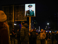 Soviet soldier picture at Checkpoint Charlie memorial site a day ahead of the 35th anniversary of the fall of the Berlin Wall. Berlin, Germa...