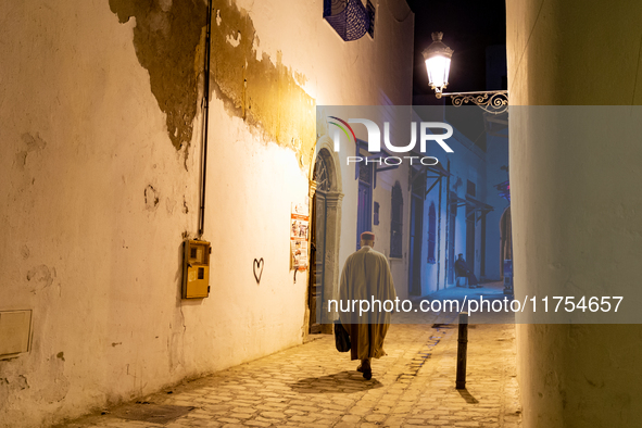 A man walks in an Old Town of Tunis, the capital of Tunisia on November 2, 2024. 