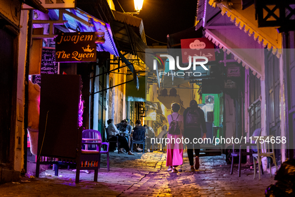 Tourists walk in an Old Town of Tunis, the capital of Tunisia on November 2, 2024. 