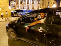 A man drives a car in an Old Town of Tunis, the capital of Tunisia on November 2, 2024. (