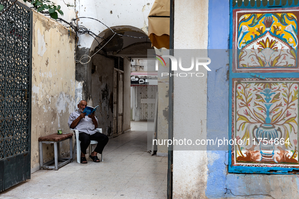 A man read in an Old Town of Soussa, Tunisia on November 2, 2024. 