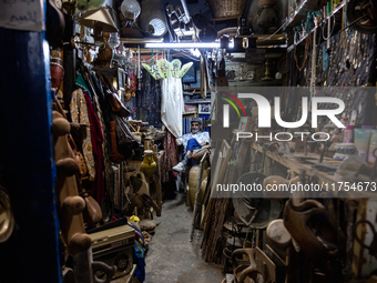 A man sell in his second hand shop in an Old Town of Kairouan in central Tunisia on October 31, 2024. (