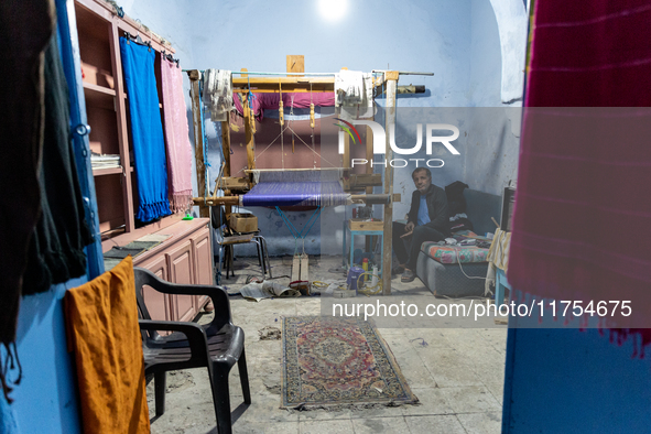 Weaver works in his workshop in an Old Town of Kairouan in central Tunisia on October 31, 2024. 