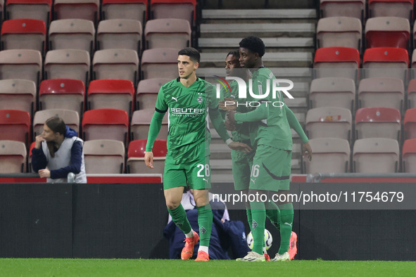 Borussia Monchengladbach's Charles Herrmann celebrates with Grant Ranos and Dillon Berko after scoring their first goal during the Premier L...