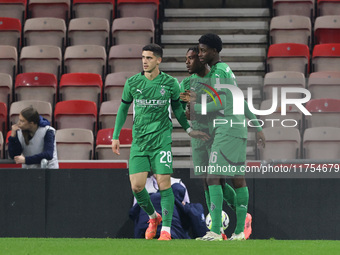 Borussia Monchengladbach's Charles Herrmann celebrates with Grant Ranos and Dillon Berko after scoring their first goal during the Premier L...