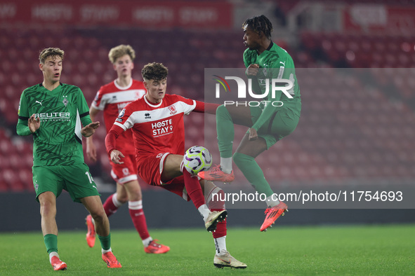 Ajay Matthews of Middlesbrough competes with Charles Herrmann of Borussia Monchengladbach during the Premier League International Cup match...