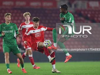 Ajay Matthews of Middlesbrough competes with Charles Herrmann of Borussia Monchengladbach during the Premier League International Cup match...