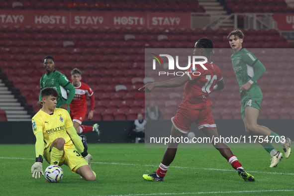 Maximillian Neutgens of Borussia Monchengladbach saves from Hareem Bakre of Middlesbrough during the Premier League International Cup match...