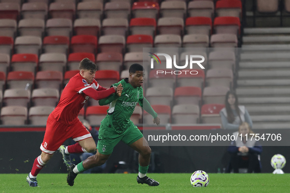 George McCormick of Middlesbrough competes for possession with Joshua Uwakhonye of Borussia Monchengladbach during the Premier League Intern...