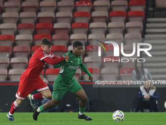 George McCormick of Middlesbrough competes for possession with Joshua Uwakhonye of Borussia Monchengladbach during the Premier League Intern...