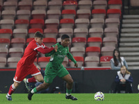 George McCormick of Middlesbrough competes for possession with Joshua Uwakhonye of Borussia Monchengladbach during the Premier League Intern...