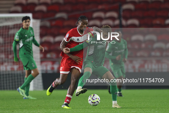 Delano Burgzorg of Middlesbrough competes for possession with Niklas Swider of Borussia Monchengladbach during the Premier League Internatio...