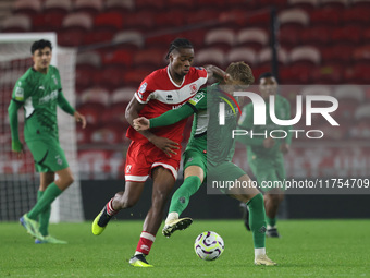 Delano Burgzorg of Middlesbrough competes for possession with Niklas Swider of Borussia Monchengladbach during the Premier League Internatio...