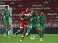 Delano Burgzorg of Middlesbrough competes for possession with Niklas Swider of Borussia Monchengladbach during the Premier League Internatio...