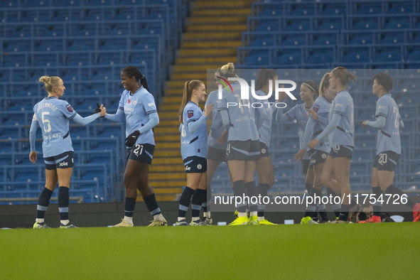 Khadija Shaw #21 of Manchester City W.F.C celebrates her goal with teammates during the Barclays FA Women's Super League match between Manch...