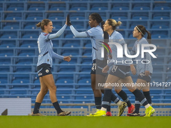 Khadija Shaw #21 of Manchester City W.F.C celebrates her goal with teammates during the Barclays FA Women's Super League match between Manch...