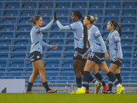 Khadija Shaw #21 of Manchester City W.F.C celebrates her goal with teammates during the Barclays FA Women's Super League match between Manch...