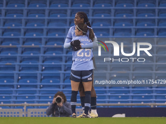 Khadija Shaw #21 of Manchester City W.F.C celebrates her goal with teammates during the Barclays FA Women's Super League match between Manch...