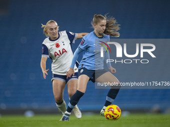 Jess Park, number 16 of Manchester City W.F.C., is tackled by an opponent during the Barclays FA Women's Super League match between Manchest...