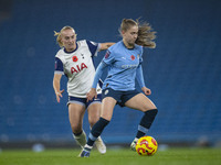 Jess Park, number 16 of Manchester City W.F.C., is tackled by an opponent during the Barclays FA Women's Super League match between Manchest...