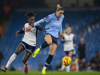 Alanna Kennedy #14 of Manchester City W.F.C. is in possession of the ball during the Barclays FA Women's Super League match between Manchest...