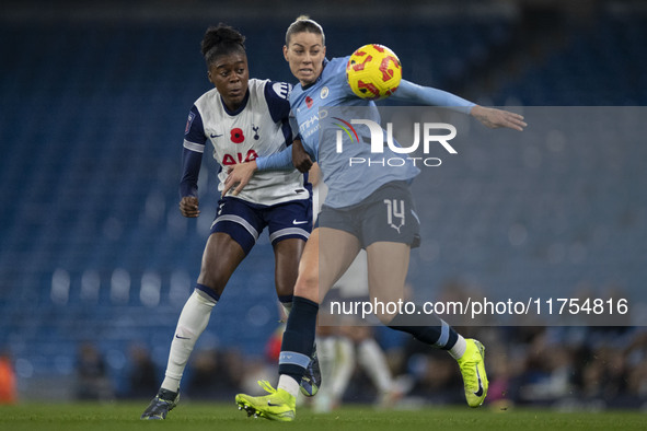 Alanna Kennedy #14 of Manchester City W.F.C. is challenged by the opponent during the Barclays FA Women's Super League match between Manches...