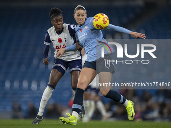 Alanna Kennedy #14 of Manchester City W.F.C. is challenged by the opponent during the Barclays FA Women's Super League match between Manches...