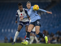 Alanna Kennedy #14 of Manchester City W.F.C. is challenged by the opponent during the Barclays FA Women's Super League match between Manches...