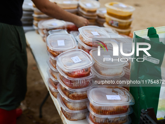 Volunteers deliver food in Benetusser, Spain, on november 08, 2024, due to the flood (