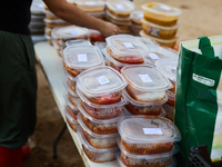 Volunteers deliver food in Benetusser, Spain, on november 08, 2024, due to the flood (