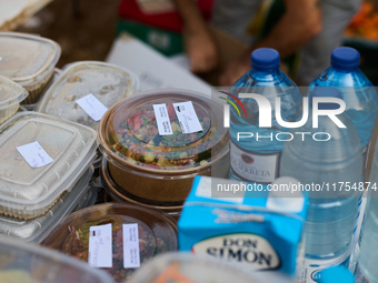 Volunteers deliver food in Benetusser, Spain, on november 08, 2024, due to the flood (